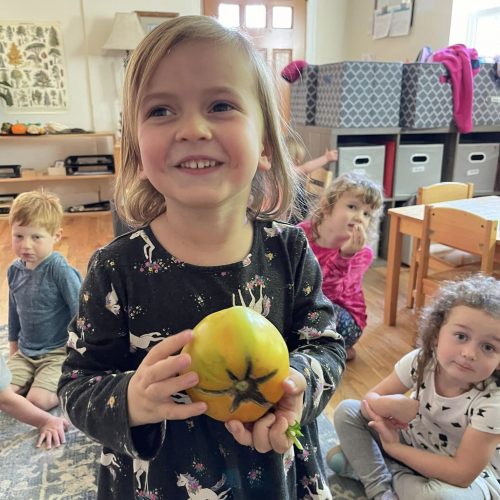 Child with tomato Child with tomato